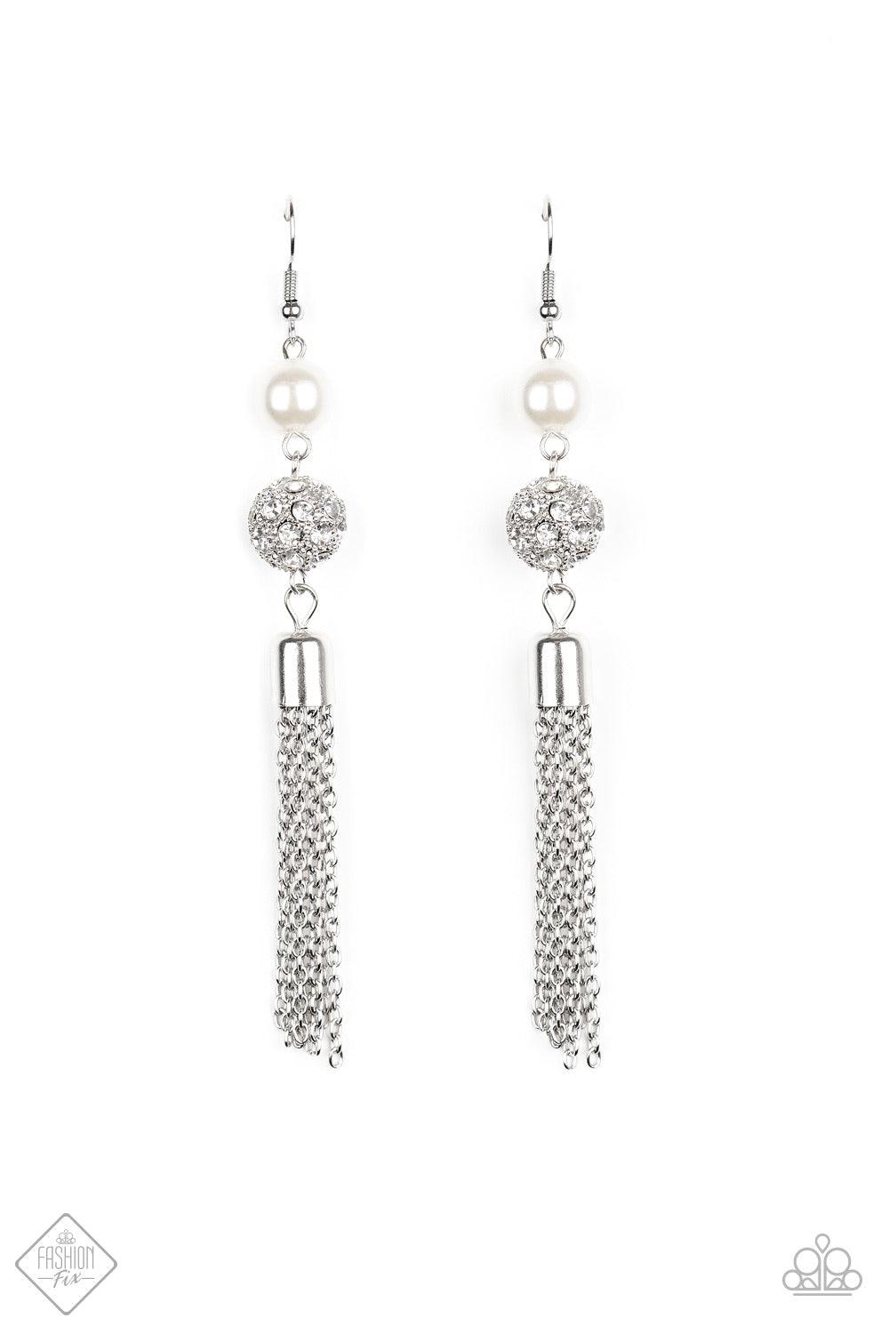 Paparazzi Accessories Going DIOR to DIOR - White A solitaire white pearl gives way to a glittery white rhinestone-encrusted silver bead. A shimmery silver tassel cascades from the bottom of the stacked elegance for a flirty finish. Earring attaches to a s
