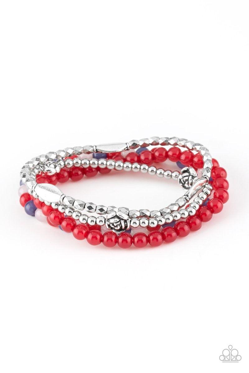 Paparazzi Accessories Blooming Buttercups - Red Mismatched silver beads and strands of glassy red beads are threaded along stretchy bands. Infused with silver accents, dainty rose blossoms adorn the wrist for a seasonal finish. Jewelry