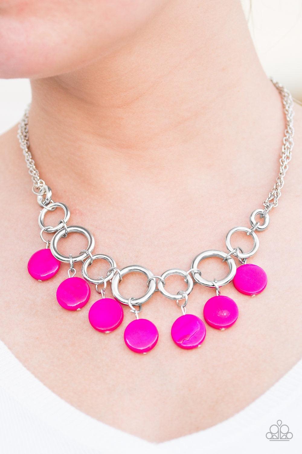 Paparazzi Accessories Coastal Adventure - Pink Brushed in a shell-like iridescence, shiny pink beading swings from the bottom of bold silver hoops, creating a colorful fringe below the collar. Features an adjustable clasp closure. Jewelry