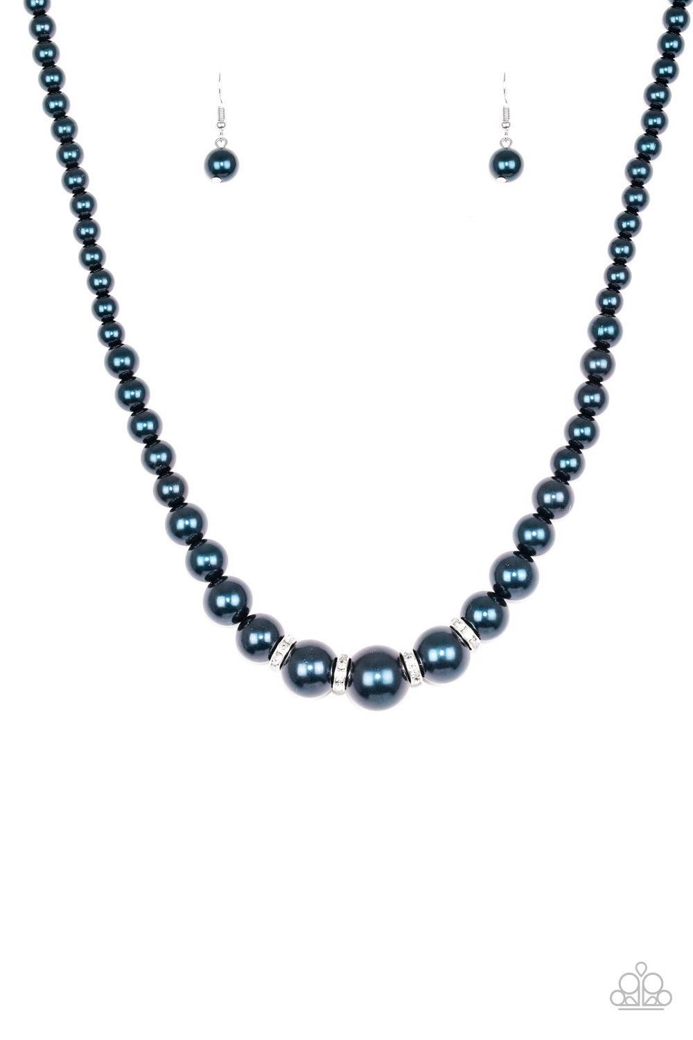 Paparazzi Accessories Party Pearls - Blue Gradually increasing in size, luminescent blue pearls trickle below the collar for a classic look. Encrusted in dazzling white rhinestones, glittery rings are sprinkled between the pearls for a timeless finish. Fe