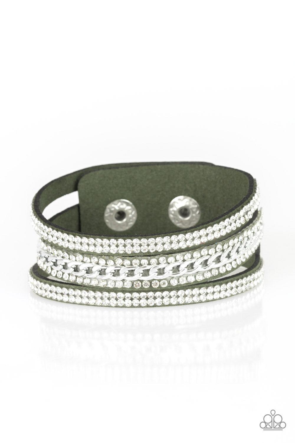 Paparazzi Accessories Rollin In Rhinestones - Green Rows of glassy white rhinestones and a shimmery silver chain are encrusted along green suede bands for a sassy look. Features an adjustable snap closure. Sold as one individual bracelet. Jewelry