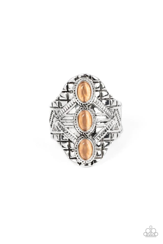 Paparazzi Accessories Eye-Catching Cat’s Eye - Orange Three oval orange cat's eye stones vertically stack down the center of an antiqued silver frame embossed in geometric detail, invoking a tribal inspired fashion. Features a stretchy band for a flexible