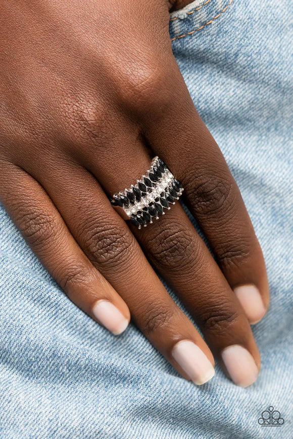 Paparazzi Accessories Cinematic Couture - Black Two rows of marquise shaped black beads are separated by a single row of glassy white rhinestones, layering into a bold pop of sparkle around the finger. Features a stretchy band for a flexible fit. Sold as