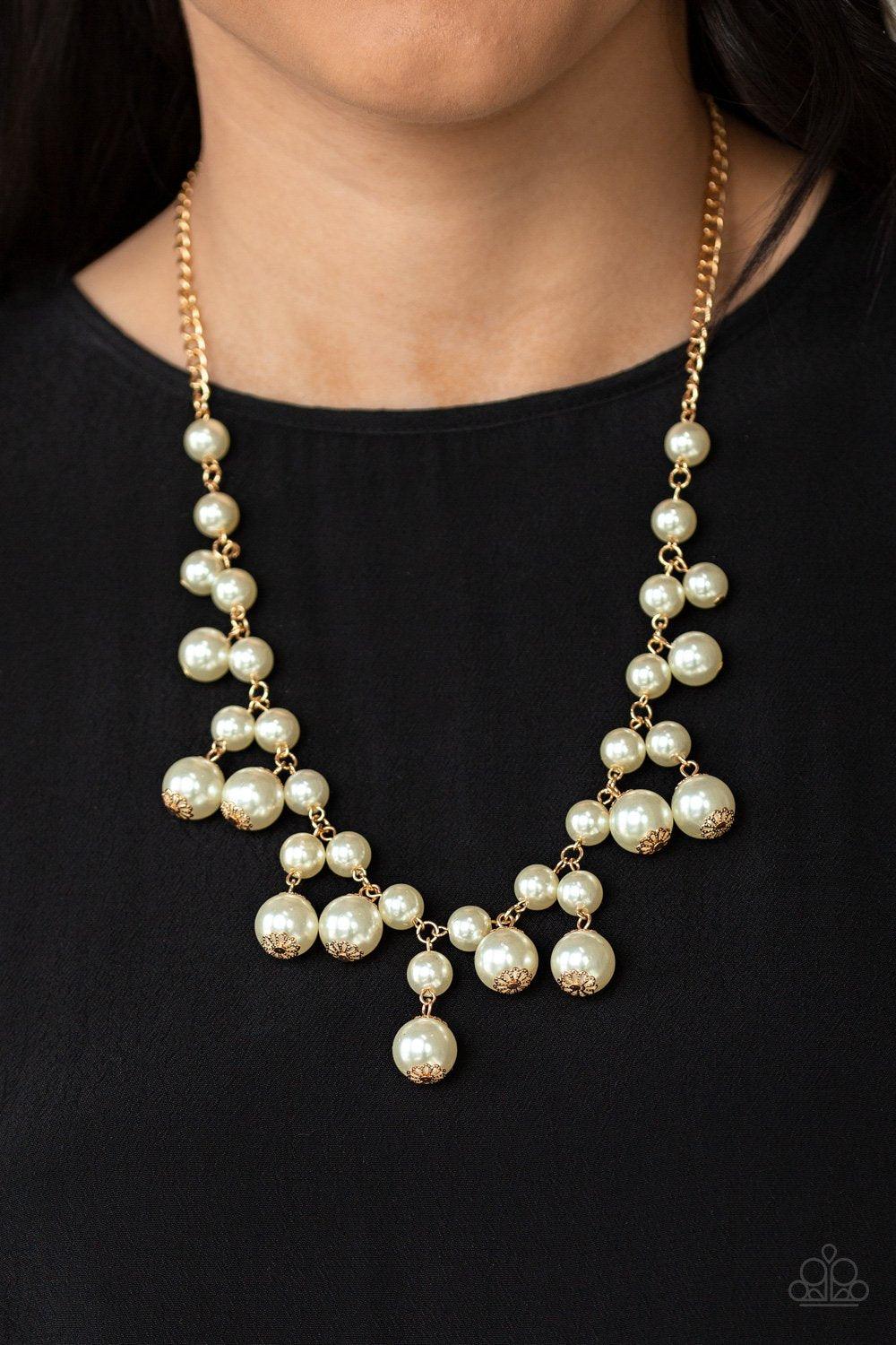 Paparazzi Accessories Soon To Be Mrs - Gold Varying in size, bubbly white pearls swing from the bottom of a classic strand of pearls, creating a refined fringe below the collar. Features an adjustable clasp closure. Sold as one individual necklace. Includ