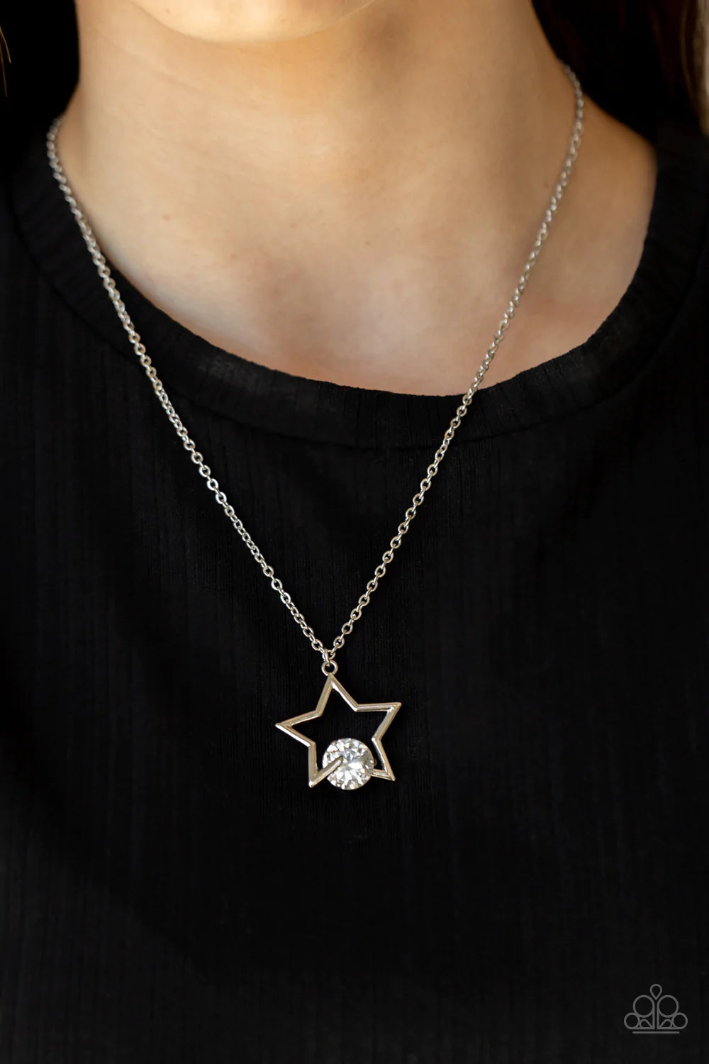Paparazzi Accessories Starry Fireworks - White The bottom of a glistening silver star frame delicately overlaps with a dramatically oversized white gem, creating a stellar patriotic inspired sparkle beneath the collar. Features an adjustable clasp closure