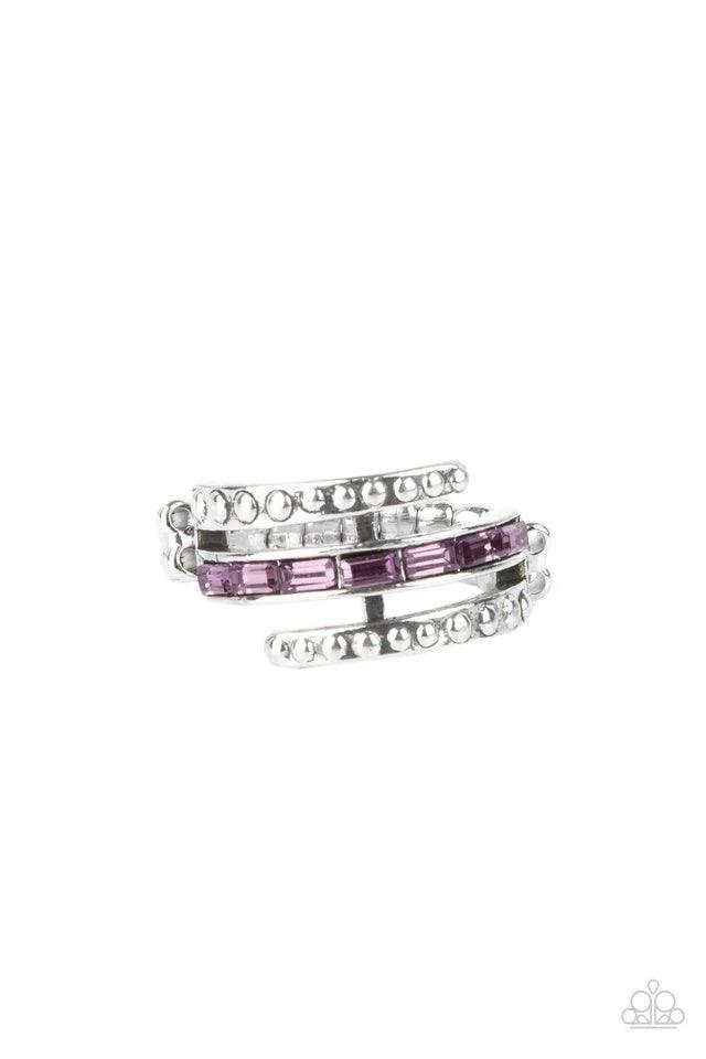 Paparazzi Accessories More To Go Around - Purple Two studded silver bars flank a dainty row of emerald cut purple rhinestones, creating the illusion of a stack of wraparound bands that make a lasting impression. Features a dainty stretchy band for a flexi