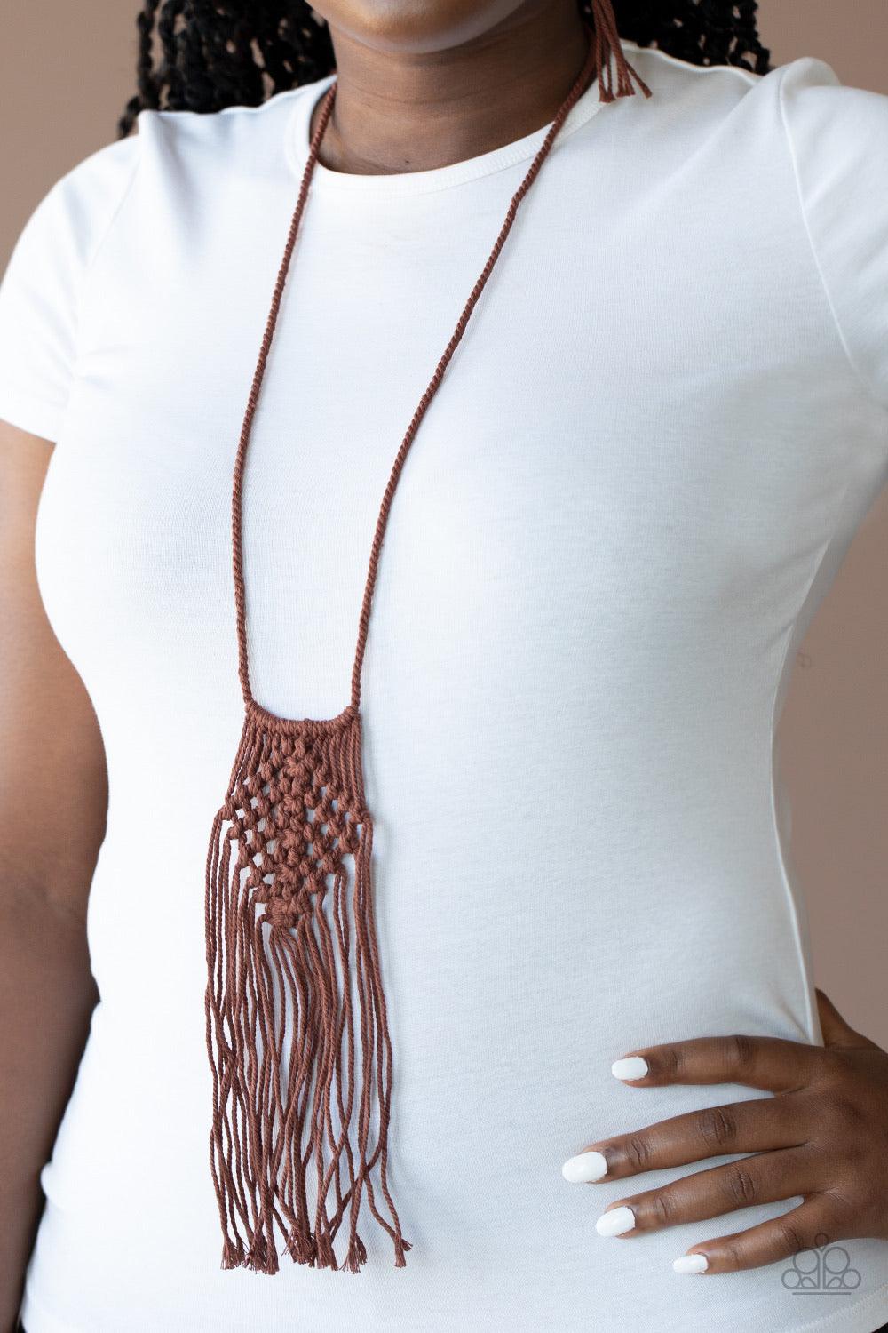 Paparazzi Accessories Macrame Mantra - Brown Brown twine-like cording decoratively knots into a macramé inspired pendant at the bottom of lengthened strands of twisted cording. Featuring frayed ends, excess cording streams from the bottom of the knotted c