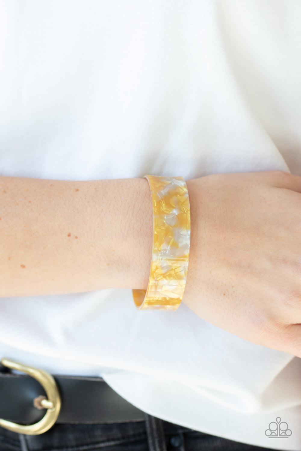 Paparazzi Accessories Glaze Daze - Yellow Featuring an iridescent shimmer, a speckled yellow acrylic cuff waves across the wrist for a colorfully retro look. Jewelry