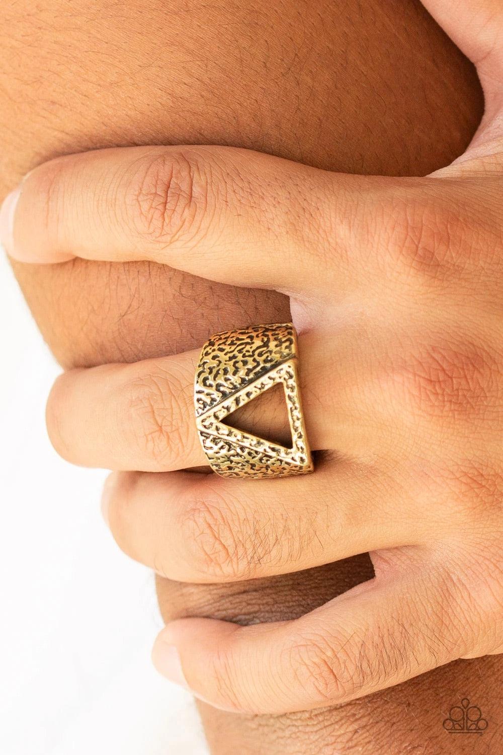 Paparazzi Accessories Triathlon - Brass An airy triangular frame is pressed into the center of a hammered brass band for an edgy look. Features a stretchy band for a flexible fit. Jewelry