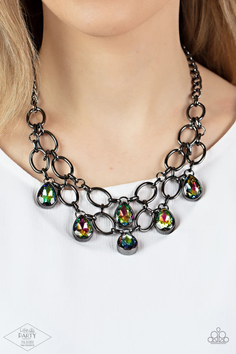 Paparazzi Accessories Show-Stopping Shimmer - Multi 2 Joined by dainty gunmetal links, two rows of dramatic gunmetal chain layer below the collar in a fierce fashion. Oil spill teardrop gems drip from the glistening layers, adding a timeless shimmer to th