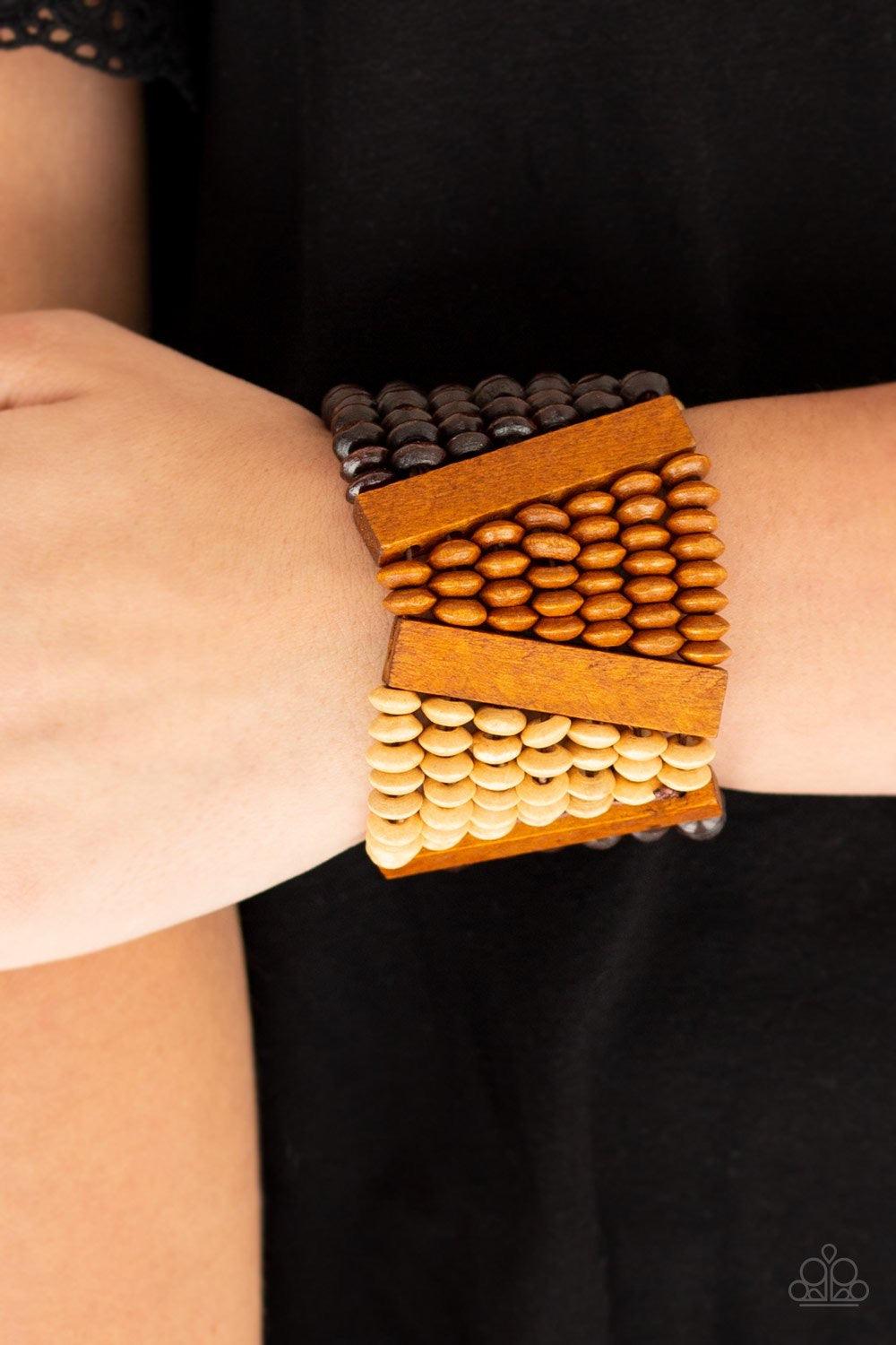 Paparazzi Accessories HAUTE IN Hispaniola - Brown A collection of round and rectangular wooden beads are threaded along stretchy bands, coalescing into an earthy beaded palette for a summery look. Sold as one individual bracelet. Jewelry