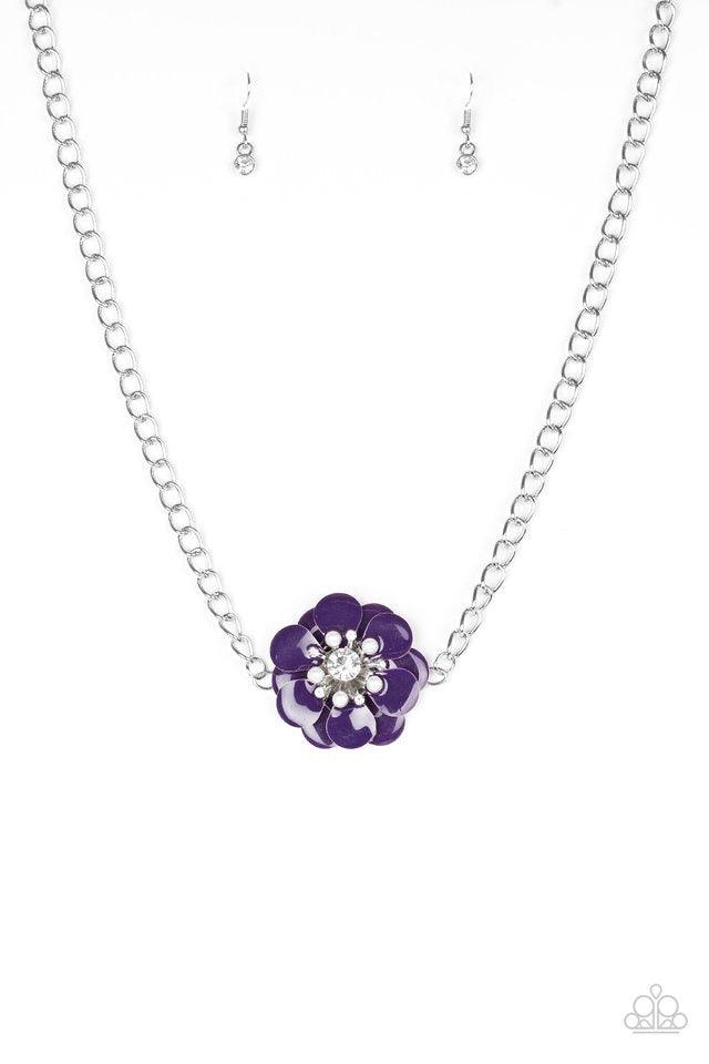 Paparazzi Accessories Hibiscus Hula - Purple Painted in a shiny purple finish, overlapping petals bloom below the collar. Dainty white pearls and glittery white rhinestones are encrusted around the center of the floral pendant for a whimsical finish. Feat