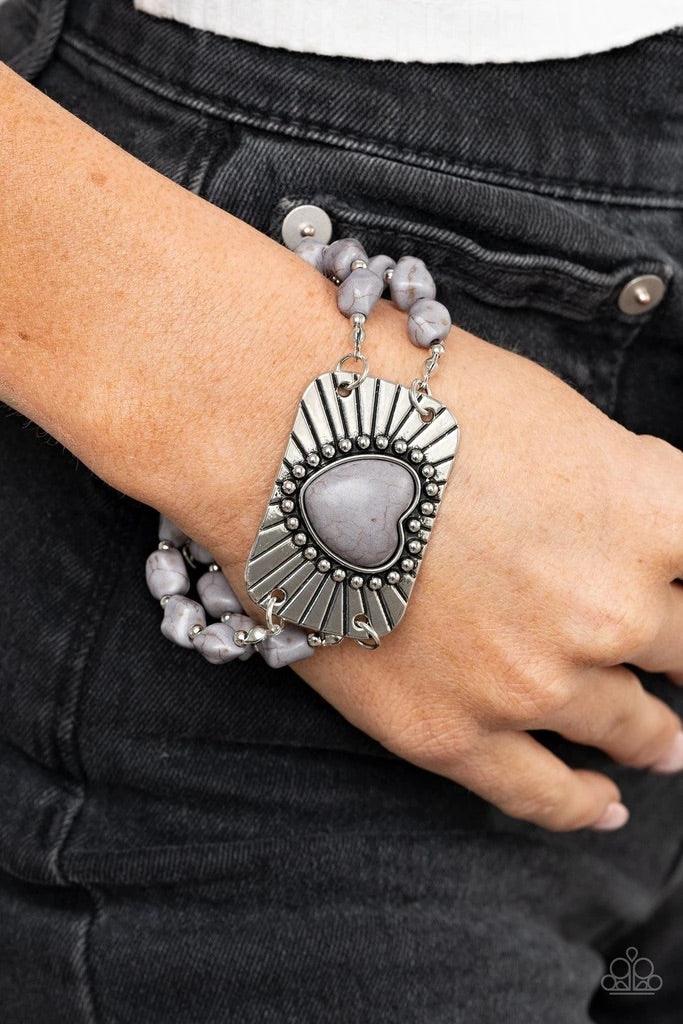 Paparazzi Accessories Sandstone Sweetheart - Silver Threaded along invisible wire, strands of gray rock beads and dainty silver accents attach to a shimmery silver plate radiating with linear and studded textures. Chiseled into a charming heart, a gray st
