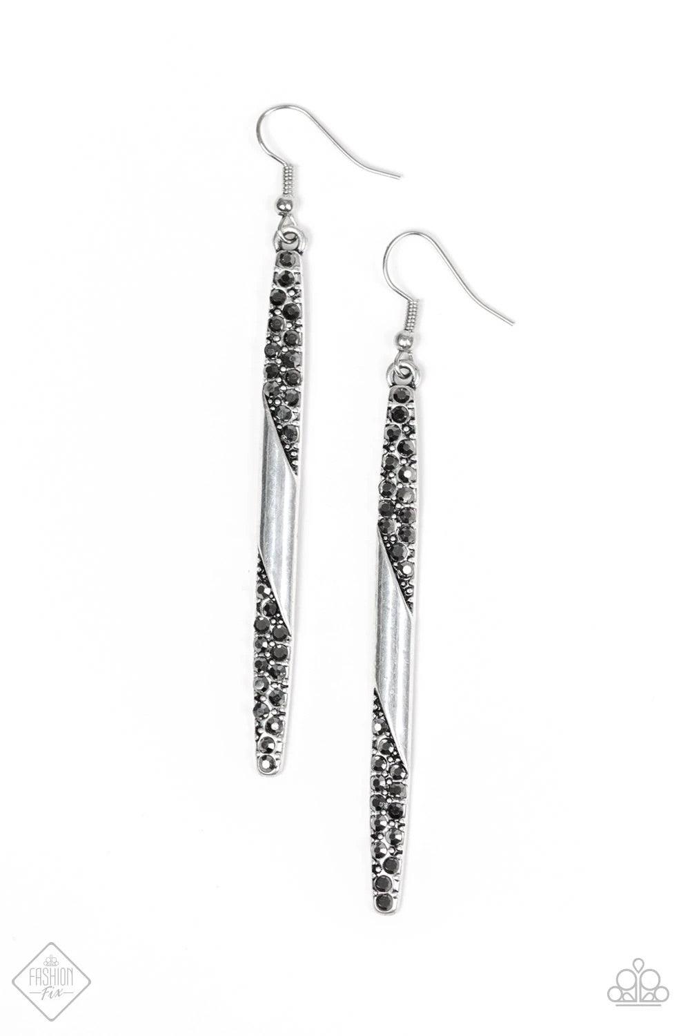 Paparazzi Accessories Award Show Attitude - Black Wrapped in ribbons of shimmer, sections of a glistening gunmetal pendulum is encrusted in glassy white rhinestones for a refined look. Earring attaches to a standard fishhook fitting. Sold as one pair of e