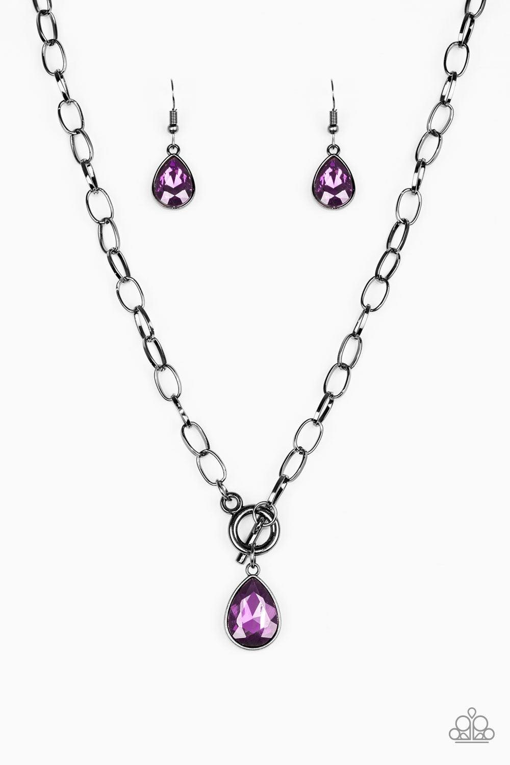 Paparazzi Accessories So Sorority - Purple A faceted purple teardrop gem swings from the bottom of a glistening gunmetal chain, creating a classic pendant below the collar. Features a toggle closure. Sold as one individual necklace. Includes one pair of m