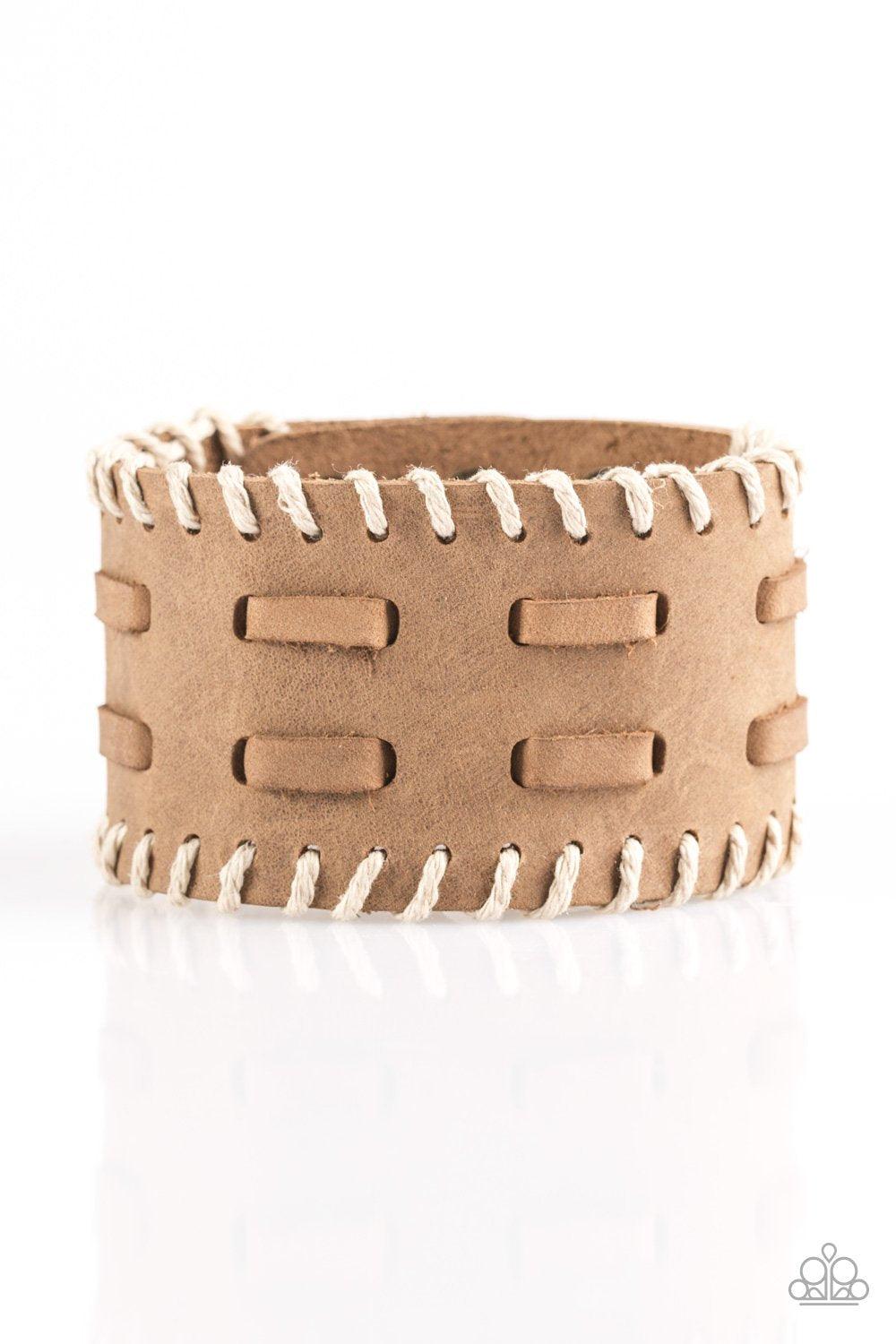 Paparazzi Accessories West RIDE Story - Brown Suede laces are threaded down the center of a thick brown suede band. Earthy twine is stitched down the edges of the band, adding a rustic finish to the urban palette. Features an adjustable snap closure. Sold