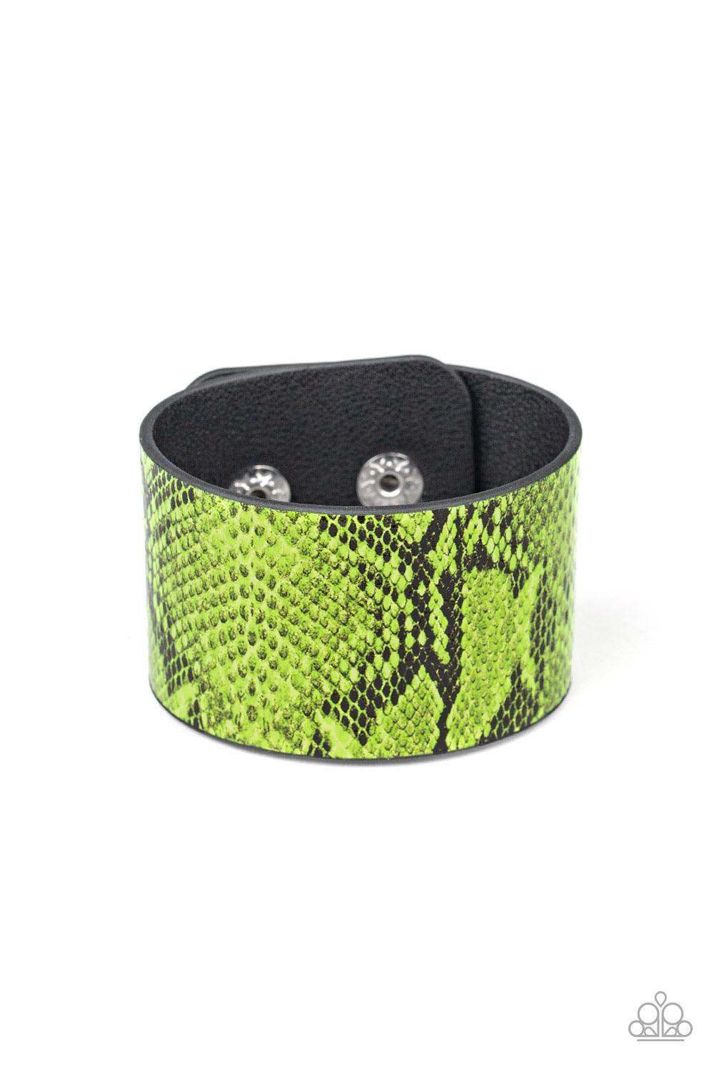 Paparazzi Accessories It’s a Jungle Out There - Green Featuring neon green python print, a thick leather band wraps around the wrist for a colorfully wild look. Features an adjustable snap closure. Jewelry