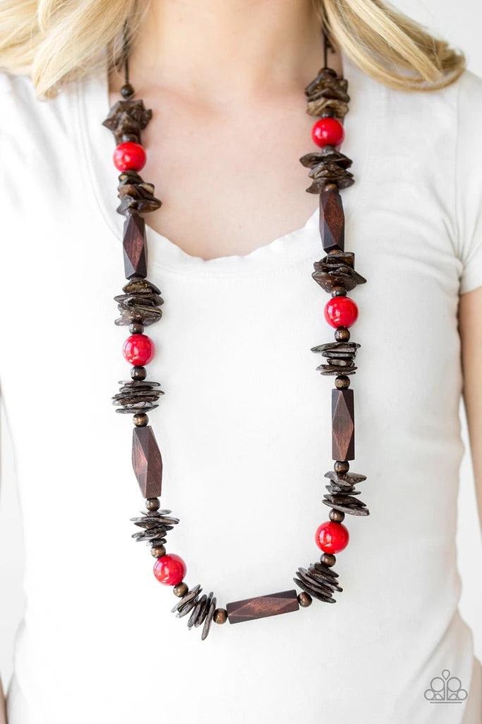 Paparazzi Accessories Cozumel Coast - Red Featuring round, faceted, and distressed finishes, mismatched brown wooden beads are threaded along shiny brown cording. Fiery red wooden beads trickle between the earthy accents, adding a colorful finish to the s
