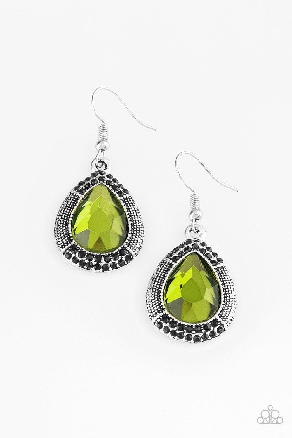 Paparazzi Accessories Grandmaster Shimmer - Green A faceted green teardrop gem is pressed into a shimmery silver frame radiating with studded details and glittery black rhinestones for a magnificent look. Earring attaches to a standard fishhook fitting. J