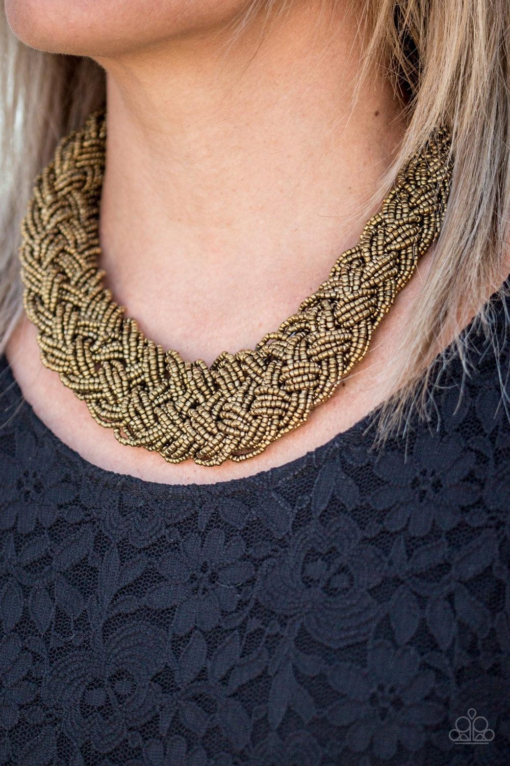 Paparazzi Accessories Mesmerizingly Mesopotamia - Brass Brushed in a metallic shimmer, brass seed beads braid into an indigenous braid below the collar for a seasonal look. Features an adjustable clasp closure. Jewelry