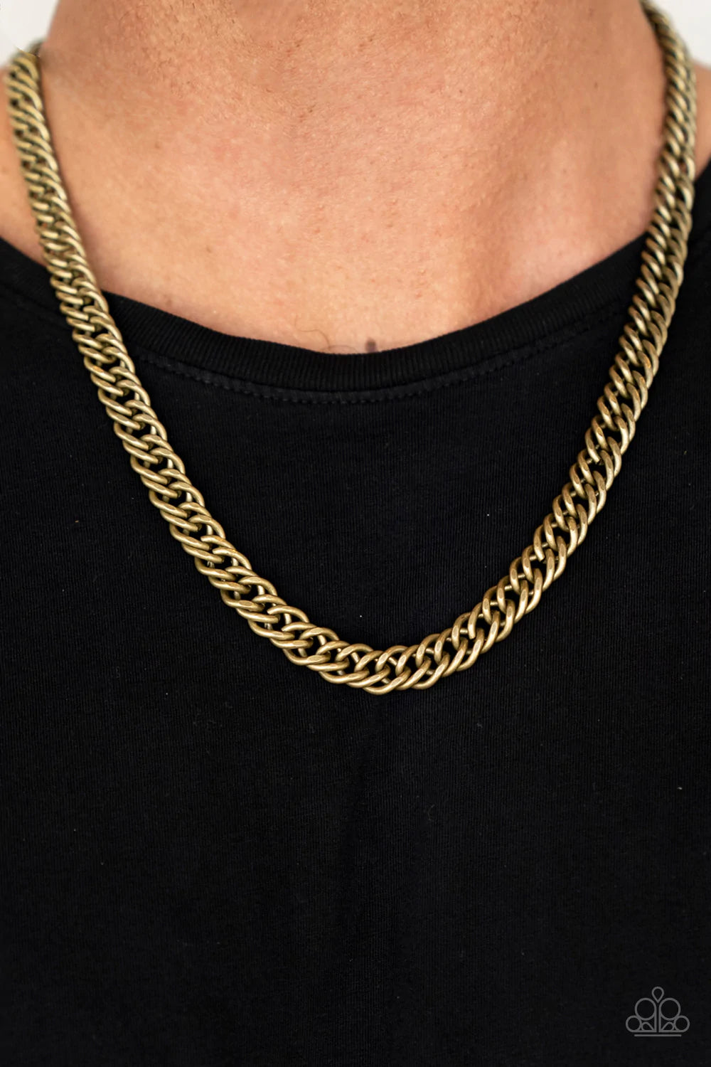 Paparazzi Accessories Winner’s Circle - Brass A soft matte finish creates a natural earthy look on a strand of uniquely faceted asymmetrical brass links. The flattened chain falls across the chest for an unapologetic industrial effect. Features an adjusta