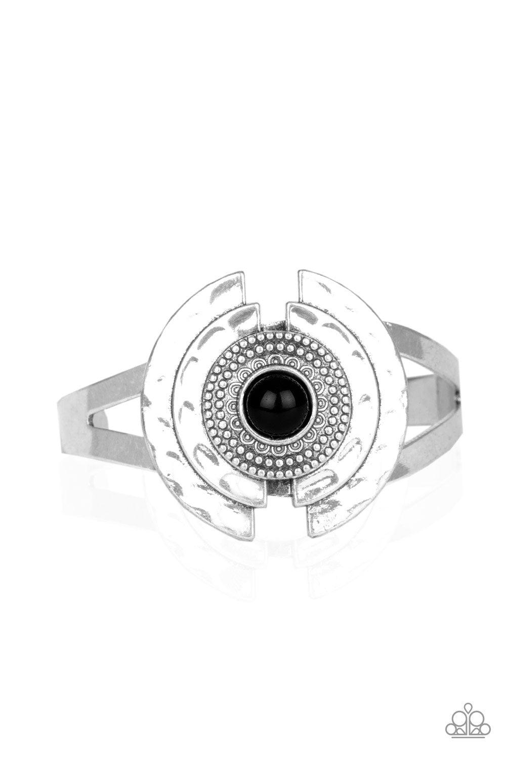 Paparazzi Accessories Incredibly Indie - Black A shiny black bead is pressed into the center of a hammered and studded silver floral frame atop an antiqued cuff for a seasonal look. Sold as one individual bracelet. Jewelry