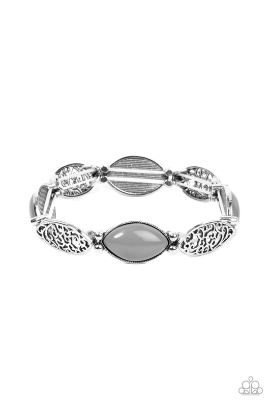 Paparazzi Accessories Garden Rendezvous - Silver Ultimate Gray beads, set in daintily studded silver frames, mingle with frames of swirling silver filigree as they alternate along stretchy bands for a whimsically wild fashion around the wrist. Sold as one