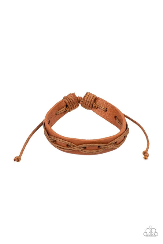 Paparazzi Accessories Macho Mystery - Brown Brown cording is interwoven across the top of a light brown leather band creating an edgy crisscrossed texture around the wrist. Features an adjustable sliding knot closure. Sold as one individual bracelet. Jewe
