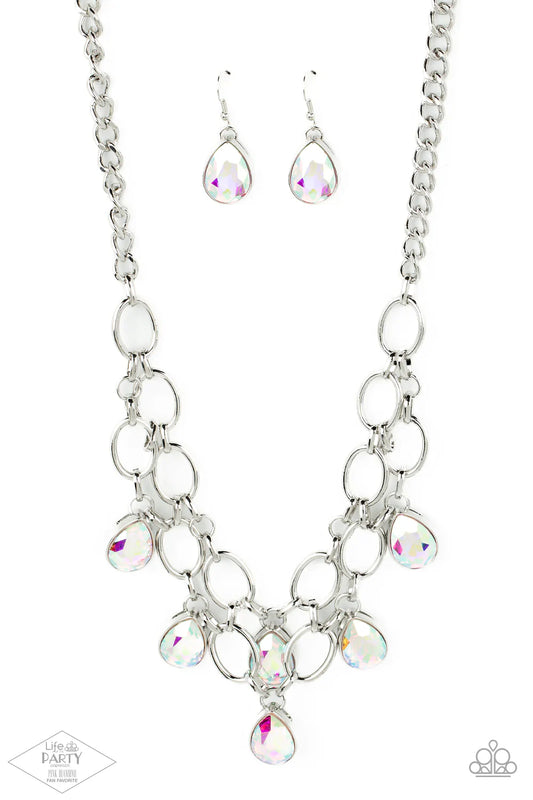 Paparazzi Accessories Show-Stopping Shimmer - Multi 1 Joined by dainty silver links, two rows of dramatic silver chain layer below the collar in a fierce fashion. Iridescent teardrop gems drip from the glistening layers, adding a timeless shimmer to the s
