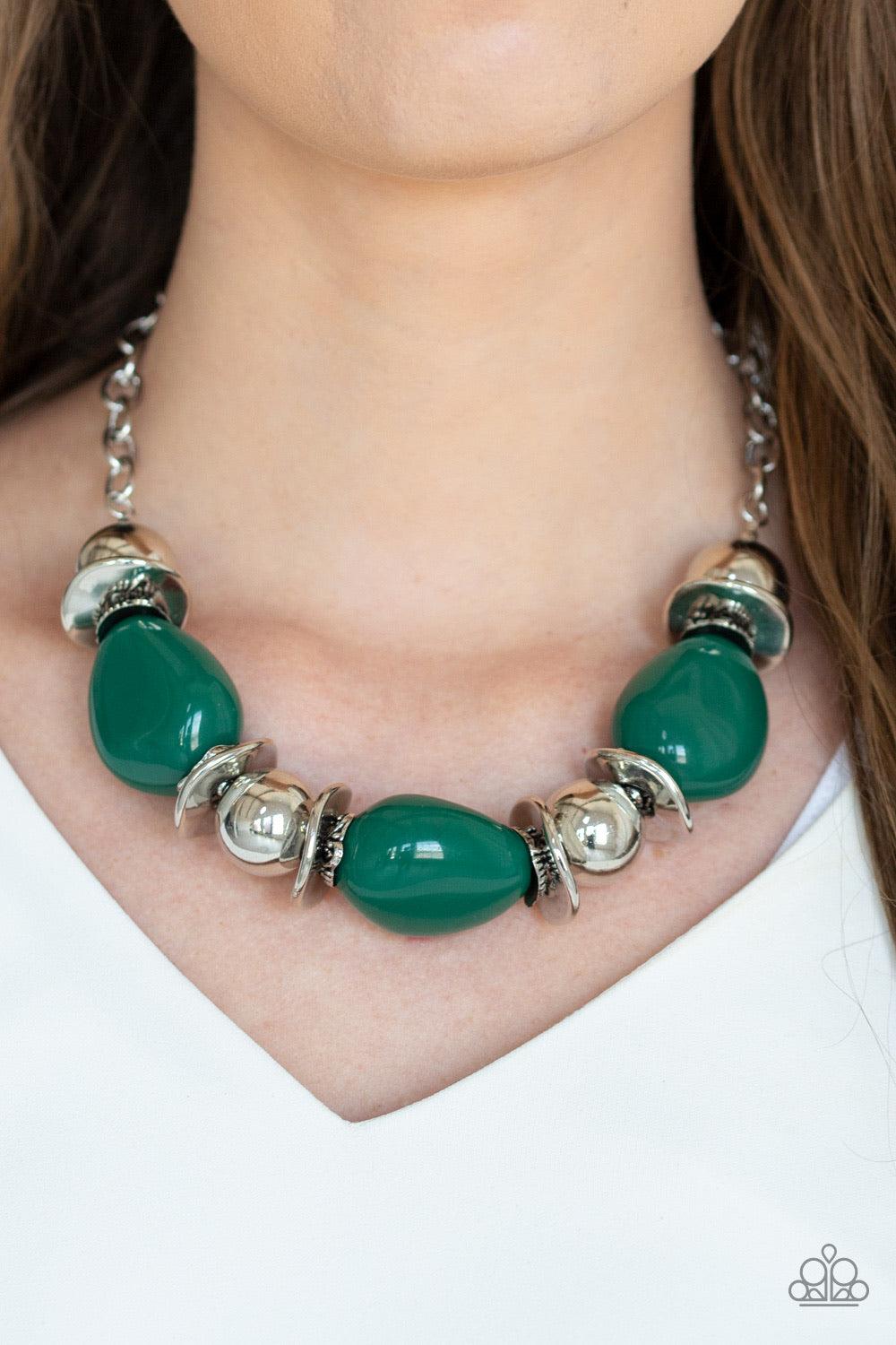 Paparazzi Accessories Vivid Vibes - Green A collection of oversized Eden beads, shiny silver beads, and beveled silver discs are threaded along an invisible wire below the collar for a vivacious look. Features an adjustable clasp closure. Jewelry