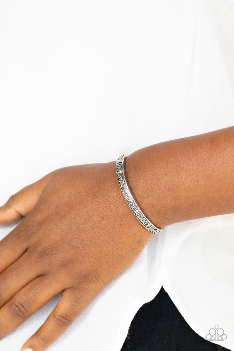 Paparazzi Accessories Precisely Petite - Silver Antiqued silver filigree vines across the front of dainty silver frames that are threaded along stretchy bands around the wrist for a seasonal look. Sold as one individual bracelet. Jewelry