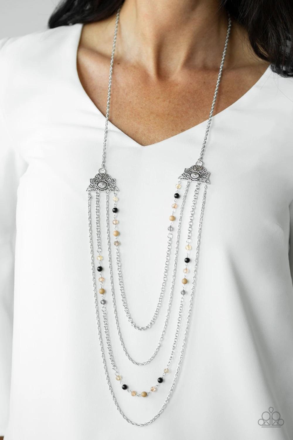 Paparazzi Accessories Pharaoh Finesse - Multi Attached to two ornate floral silver fittings, shimmery silver chains and strands of polished brown, black, and glassy crystal-like beads cascade across the chest for a whimsically layered look. Features an ad