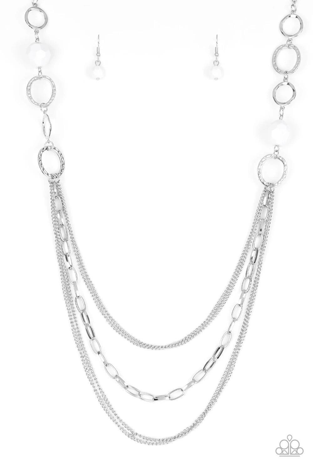 Paparazzi Accessories Margarita Masquerades - White Faceted white beads and hammered silver hoops give way to layers of mismatched silver chains for a whimsical look. Features an adjustable clasp closure. Sold as one individual necklace. Includes one pair