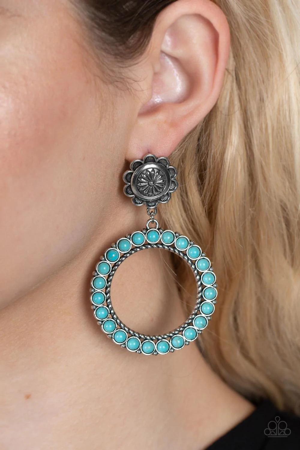 Paparazzi Accessories Playfully Prairie - Blue Featuring studded and twisted rope-like silver accents, a turquoise stone dotted hoop swings from the bottom of a rustic silver flower for a whimsically floral fashion. Earring attaches to a standard post fit