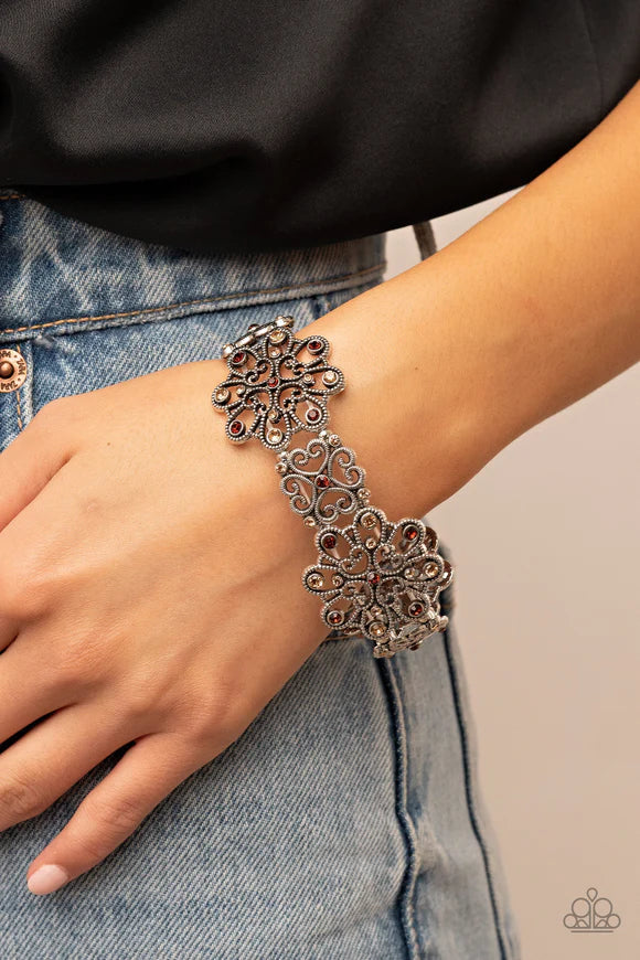 Paparazzi Accessories Regal Recognition - Brown Dainty topaz and golden topaz rhinestones scatter across the fronts of airy medallions fashioned from whimsical heart-shaped filigree. The splendid frames alternate along stretchy bands resulting in a regall