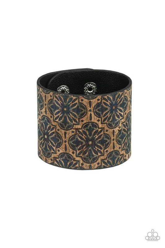 Paparazzi Accessories Cork Culture - Blue Painted in a regal blue floral pattern, a thick cork-like leather band wraps around the wrist for a statement-making look. Features an adjustable snap closure. Sold as one individual bracelet. Jewelry