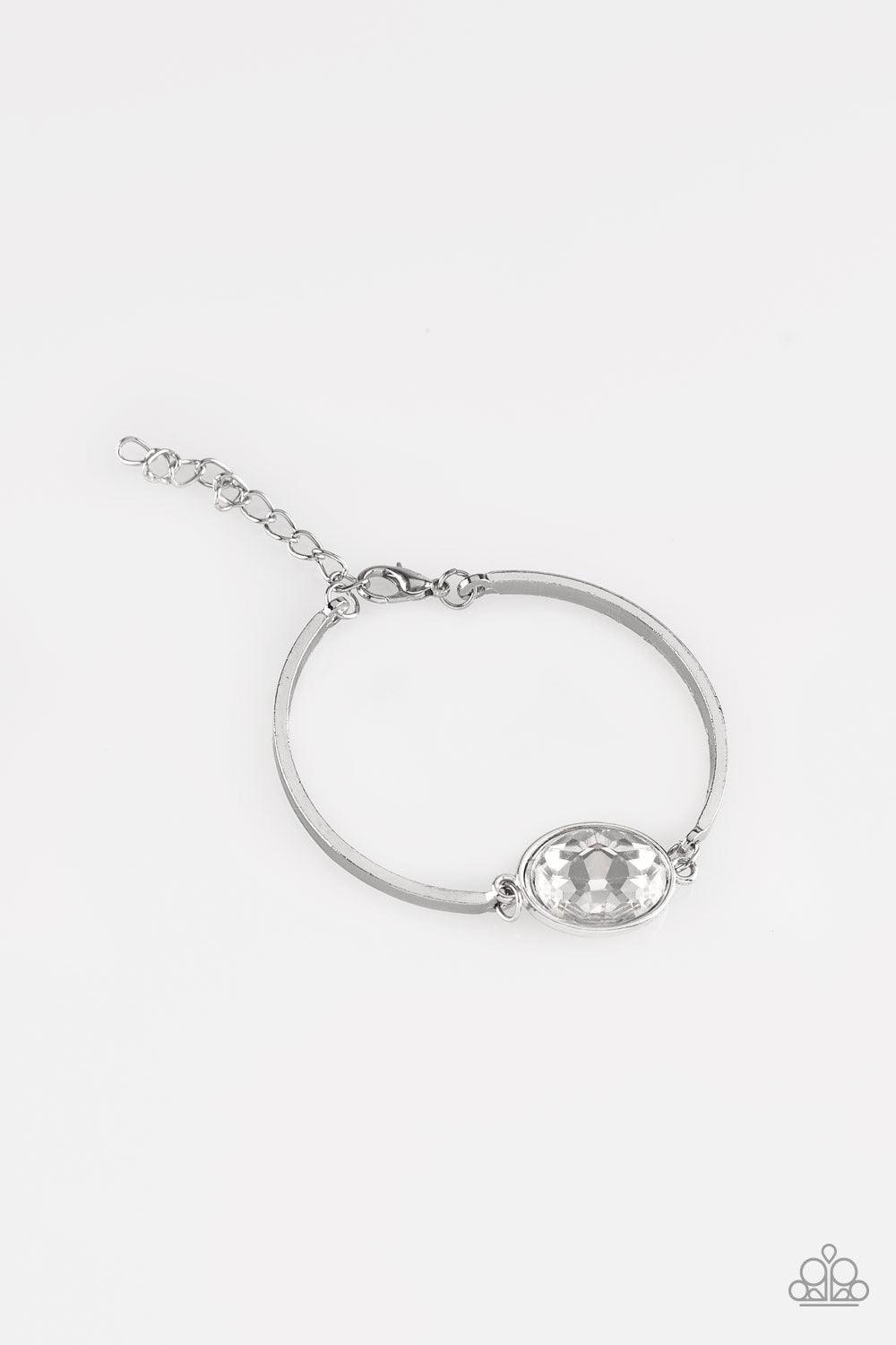Paparazzi Accessories Definitely Dashing - White Arcing silver bars connect to a faceted white gem centerpiece, creating a dainty cuff-like bracelet around the wrist. Features an adjustable clasp closure. Sold as one individual bracelet. Jewelry