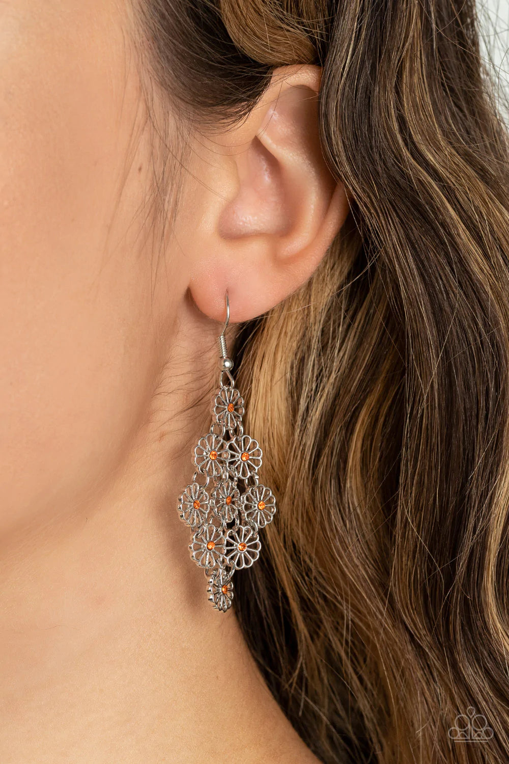 Paparazzi Accessories Bustling Blooms - Orange Dotted with dainty orange rhinestone centers, an airy collection of stenciled silver flowers link into a whimsical floral lure. Earring attaches to a standard fishhook fitting. Sold as one pair of earrings. J