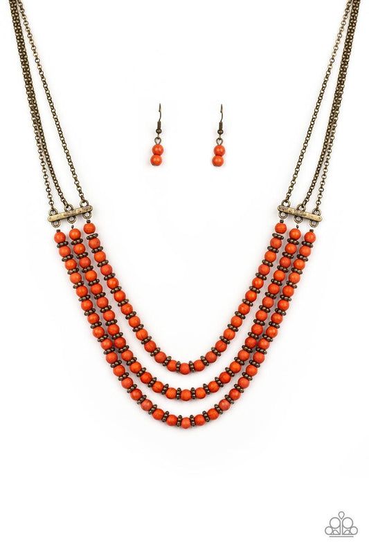 Paparazzi Accessories Terra Trails - Orange Strands of refreshing orange stones and textured brass accents are threaded along invisible wires streaming from the bottom of dainty brass chains, creating earthy layers below the collar. Features an adjustable