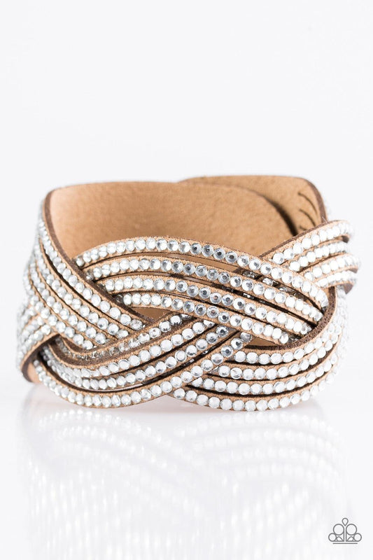 Paparazzi Accessories Big City Shimmer - Brown Glassy white rhinestones are encrusted along crisscrossing strands of brown suede, creating bold shimmer around the wrist. Features an adjustable snap closure. Jewelry