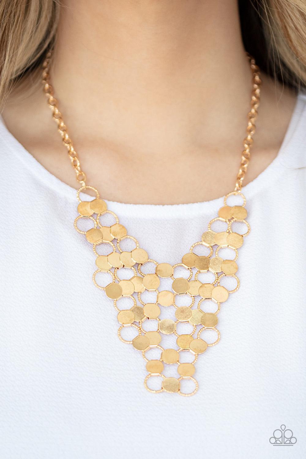 Paparazzi Accessories Net Result - Gold An interlocking net of textured gold rings and reflective gold discs link into a dramatically netted fringe below the collar. Features an adjustable clasp closure. Jewelry