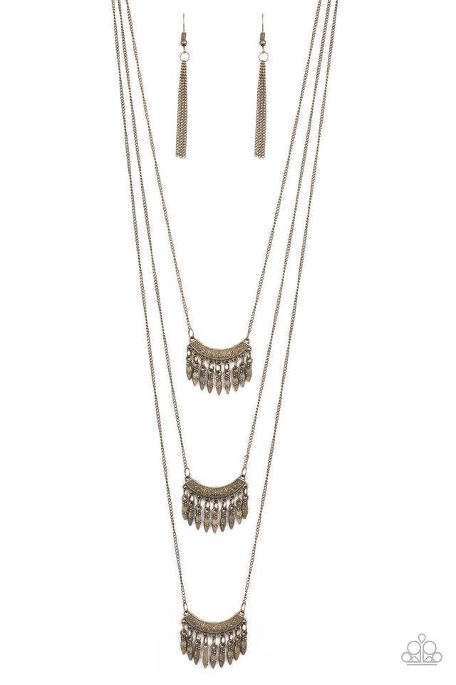 Paparazzi Accessories Seasonal Charm - Brass Infused with beaded brass fringes, floral embossed brass frames layer down the chest in a whimsically stacked fashion. Features an adjustable clasp closure. Jewelry