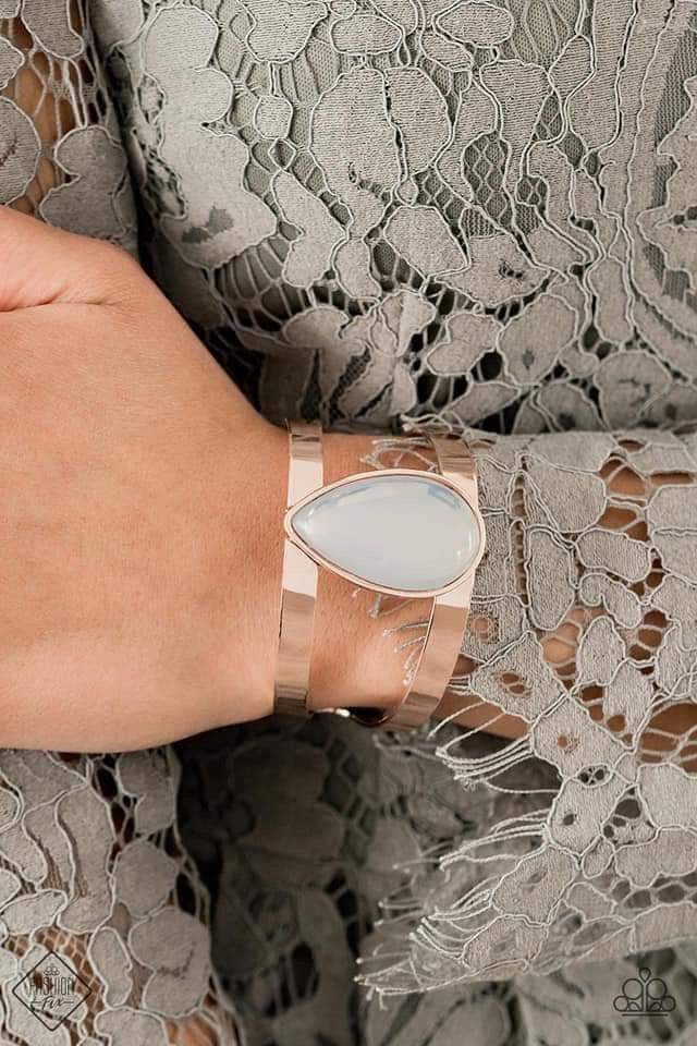 Paparazzi Accessories Optimal Opalescence - Gold Featuring a sleek rose gold frame, an opalescent white teardrop bead sits atop an airy rose gold cuff in an ethereal fashion. Sold as one individual bracelet. Jewelry