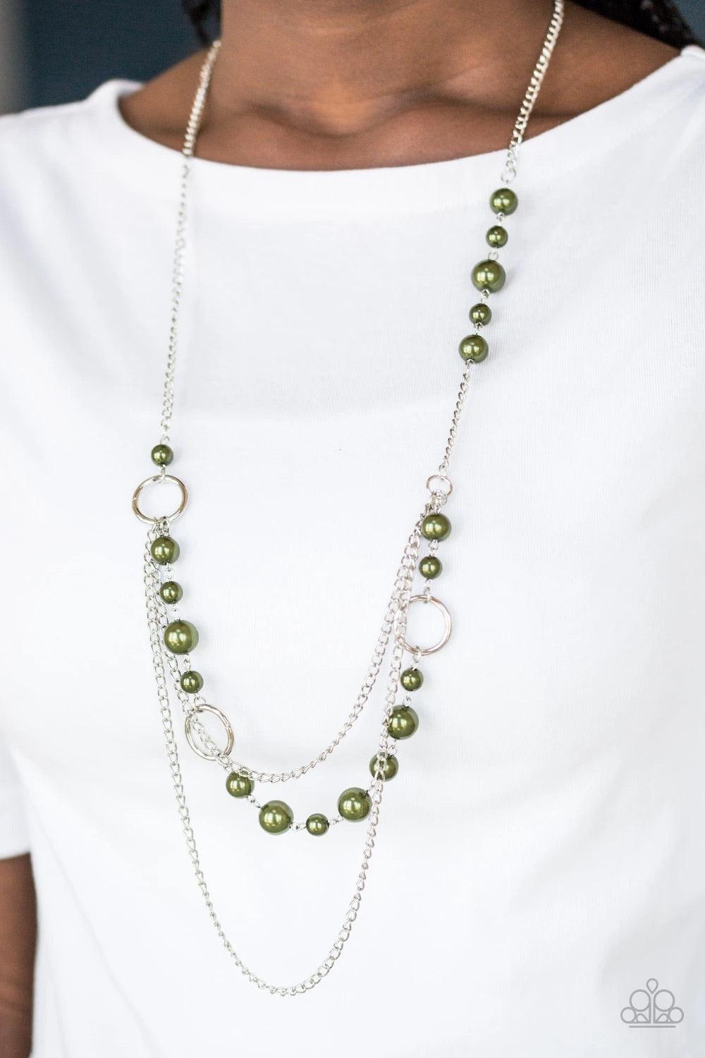Paparazzi Accessories Party Dress Princess - Green Pearly green beads and shimmery silver hoops trickle along glistening silver chains, creating mismatched layers down the chest. Features an adjustable clasp closure. Sold as one individual necklace. Inclu