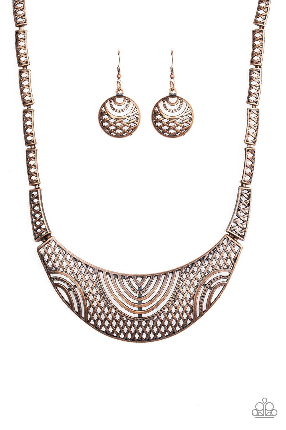 Paparazzi Accessories On The MANE Stage - Copper Featuring crisscrossed detail, dainty copper frames link below the collar, giving way to a dramatic half-moon plate radiating with airy tribal details for a fierce look. Features an adjustable clasp closure