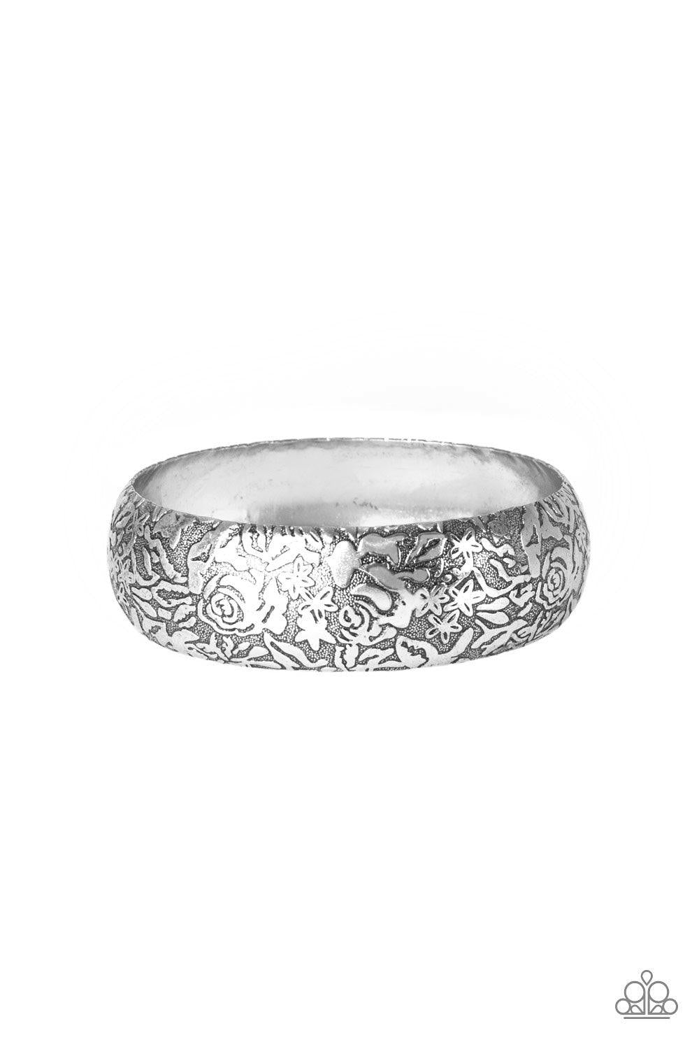Paparazzi Accessories Garden Villa - Silver Brushed in an antiqued finish, a rosy floral pattern is embossed across a thick silver bangle for a seasonal flair. Sold as one individual bracelet. Jewelry