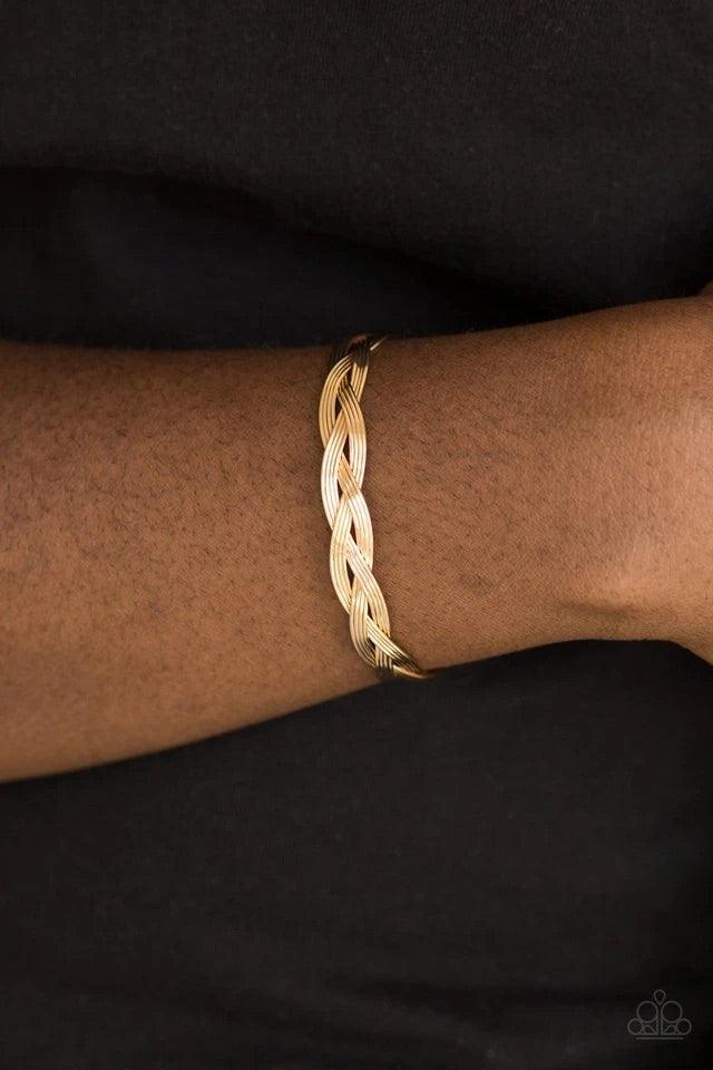 Paparazzi Accessories Business As Usual - Gold Glistening gold wires braid across the wrist, coalescing into a dainty cuff. Sold as one individual bracelet. Jewelry