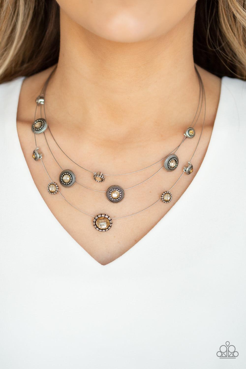 Paparazzi Accessories SHEER Thing - Brown Dotted with topaz rhinestone centers, an array of ornate silver frames trickle along skinny silver wires below the collar for a whimsical flair. Features an adjustable clasp closure. Jewelry