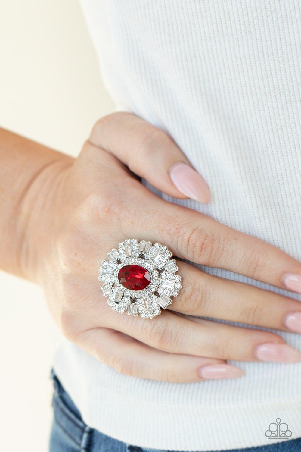 Paparazzi Accessories Iceberg Ahead - Red A sparkly series of round and emerald-cut rhinestone petals flare out from a red oval rhinestone center, creating a dramatically oversized centerpiece atop the finger. Features a stretchy band for a flexible fit.