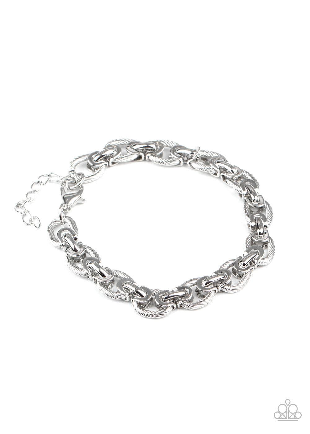 Paparazzi Accessories Gridiron Grunge - Silver Textured silver links are joined together with sleek silver fittings around the wrist, creating an ornate chain. Features an adjustable clasp closure. Jewelry